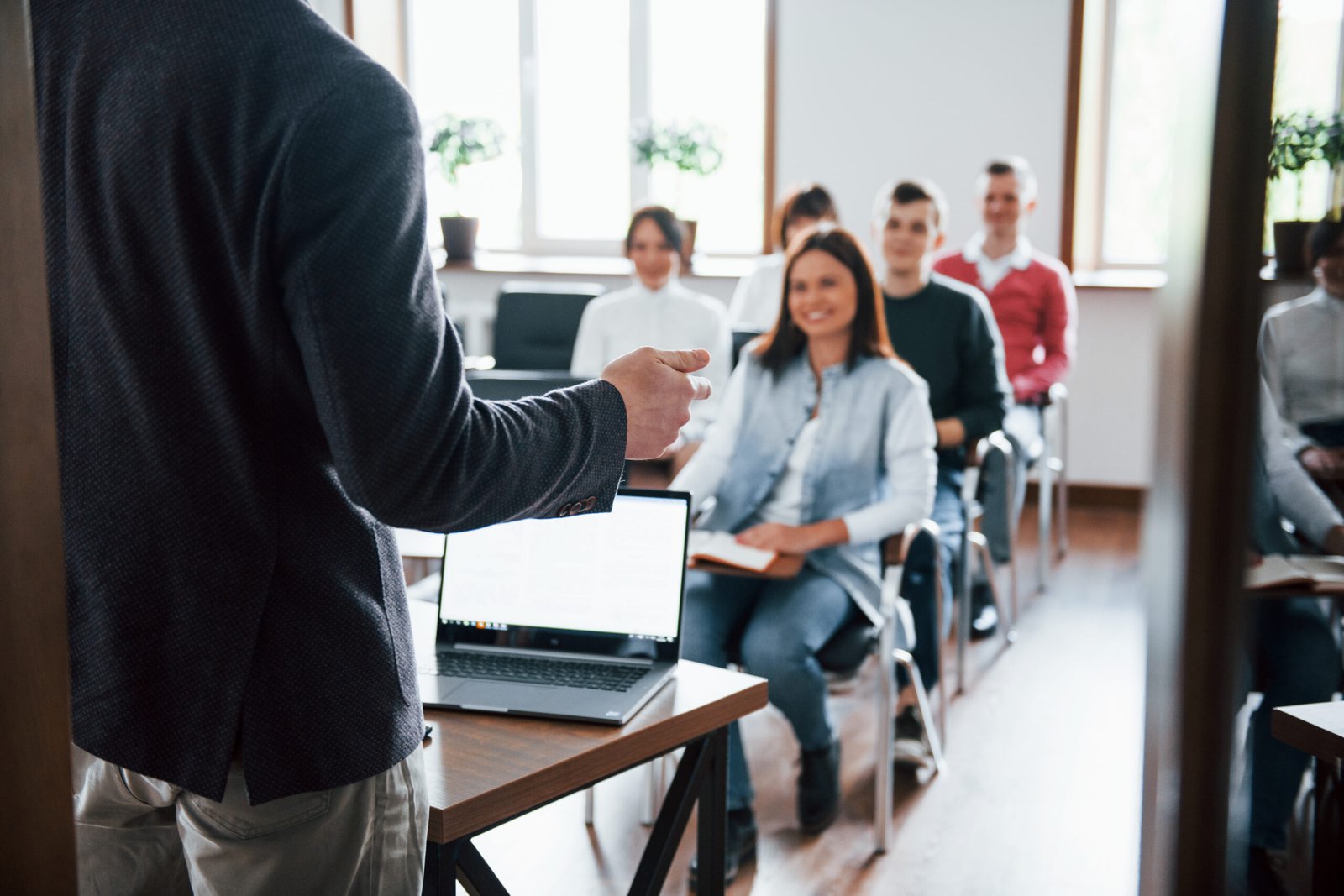 cheerful mood. group of people at business conference in modern classroom at daytime